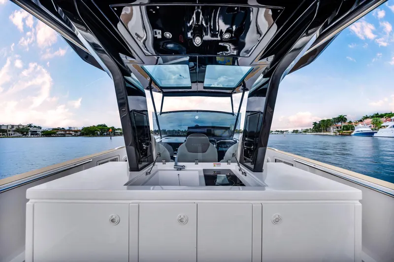Vector 9 Yacht Photos Pics Interior view of 2021 Pardo Yachts 38, showcasing sleek design and waterfront scenery.