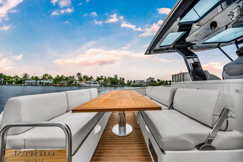 Vector 9 Yacht Photos Pics Luxurious 2021 Pardo Yachts 38 with elegant seating and scenic waterfront view.