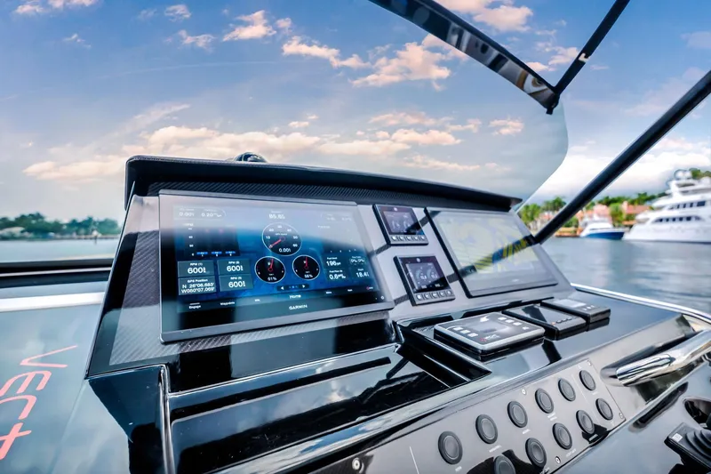 Vector 9 Yacht Photos Pics Helm of 2021 Pardo Yachts 38 with advanced navigation displays, docked by the water.