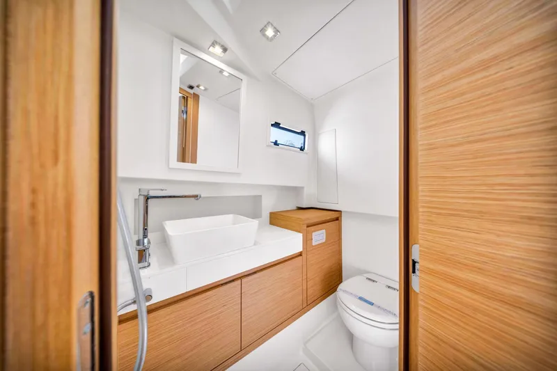 Vector 9 Yacht Photos Pics Modern bathroom interior on 2021 Pardo Yachts 38, featuring sleek wood finishes and contemporary fixtures.