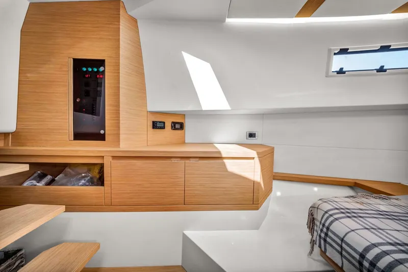 Vector 9 Yacht Photos Pics Interior of 2021 Pardo Yachts 38, featuring modern wood cabinetry and a cozy bed.