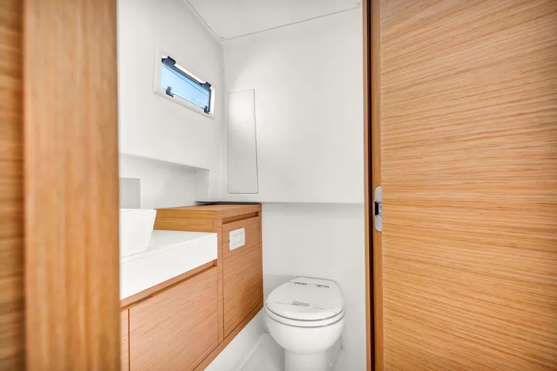 Vector 9 Yacht Photos Pics Modern bathroom interior on 2021 Pardo Yachts 38, featuring sleek wood finishes and compact design.
