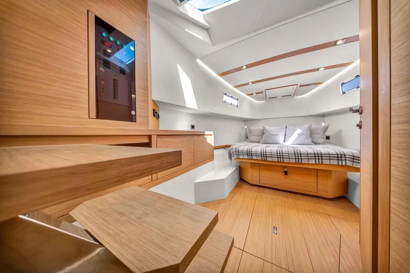Vector 9 Yacht Photos Pics Luxurious interior of 2021 Pardo Yachts 38, featuring a cozy cabin with modern wood finishes.