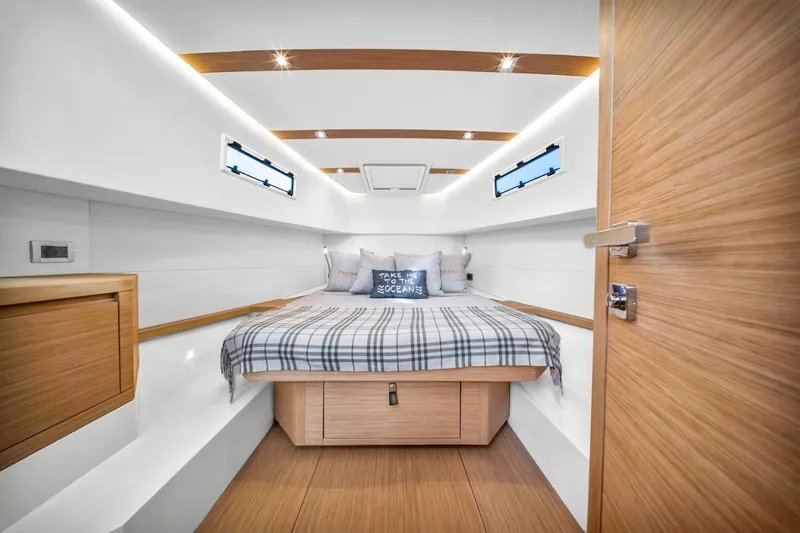Vector 9 Yacht Photos Pics Luxurious cabin interior of 2021 Pardo Yachts 38 with modern design and cozy bedding.