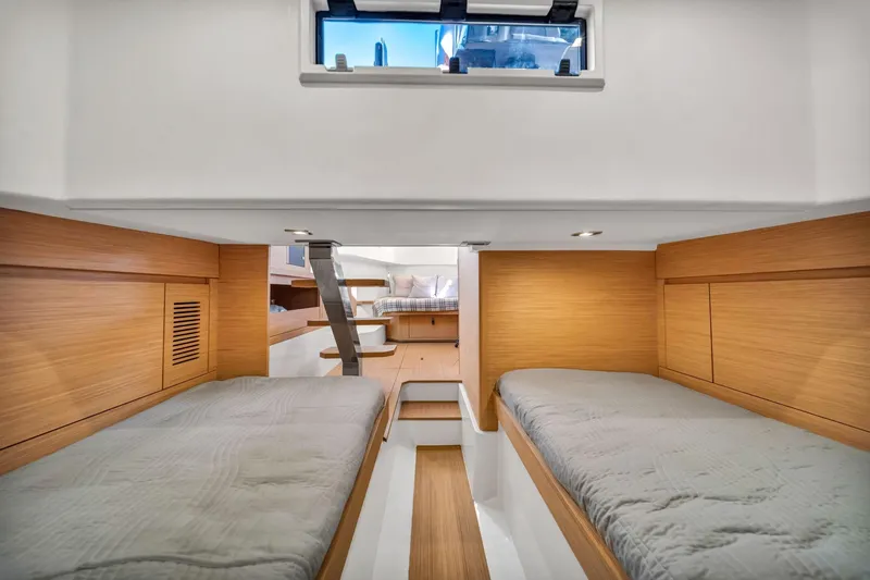 Vector 9 Yacht Photos Pics Cabin interior of 2021 Pardo Yachts 38 with twin beds and wooden finish.