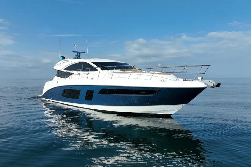 Special K Yacht Photos Pics 2016 Sea Ray L650 yacht on calm ocean under blue sky.