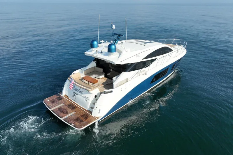 Special K Yacht Photos Pics Luxurious 2016 Sea Ray L650 yacht cruising on calm ocean waters.