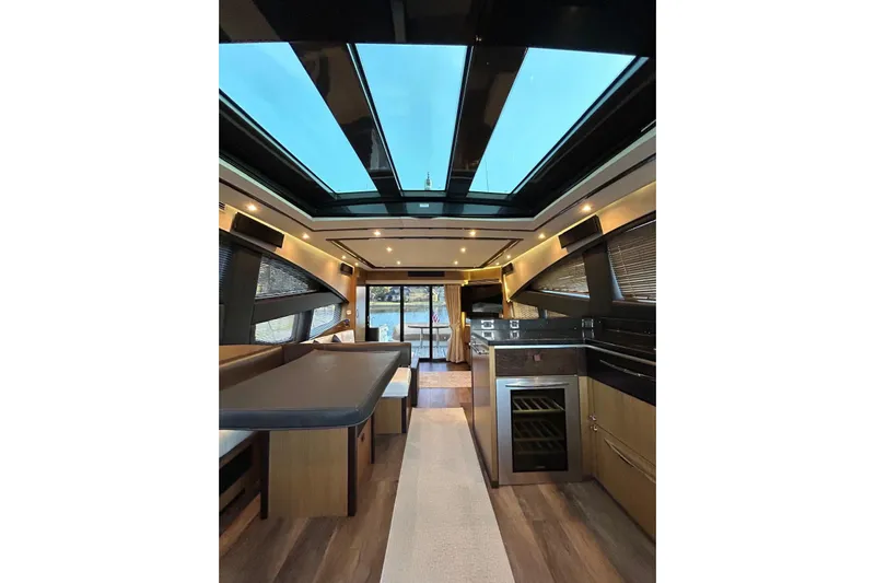 Special K Yacht Photos Pics Luxurious interior of 2016 Sea Ray L650 yacht with skylight and modern furnishings.