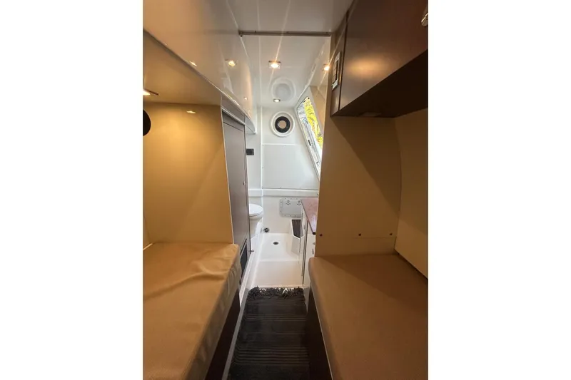 Special K Yacht Photos Pics Interior of 2016 Sea Ray L650 yacht cabin with twin beds and modern design.