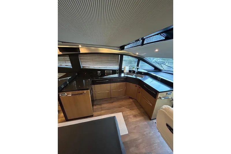 Special K Yacht Photos Pics Luxurious interior of 2016 Sea Ray L650 yacht with modern kitchen design.