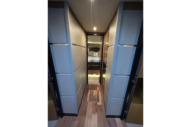 Special K Yacht Photos Pics Luxurious interior hallway of 2016 Sea Ray L650 yacht, featuring modern design and ambient lighting.