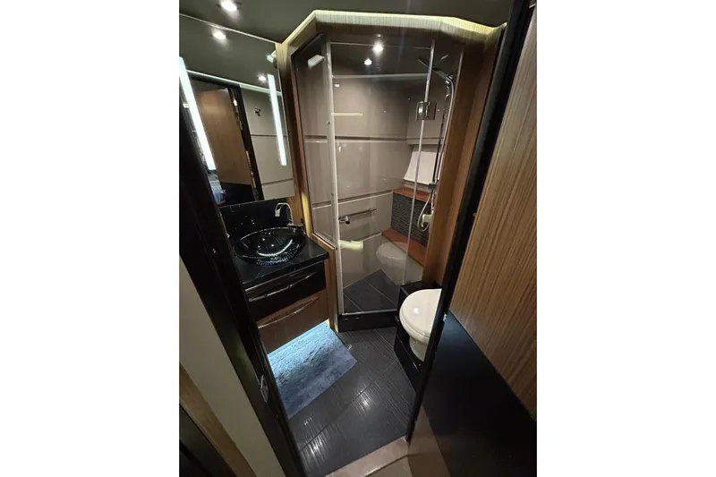 Special K Yacht Photos Pics Luxurious bathroom in 2016 Sea Ray L650 yacht with modern fixtures and elegant design.