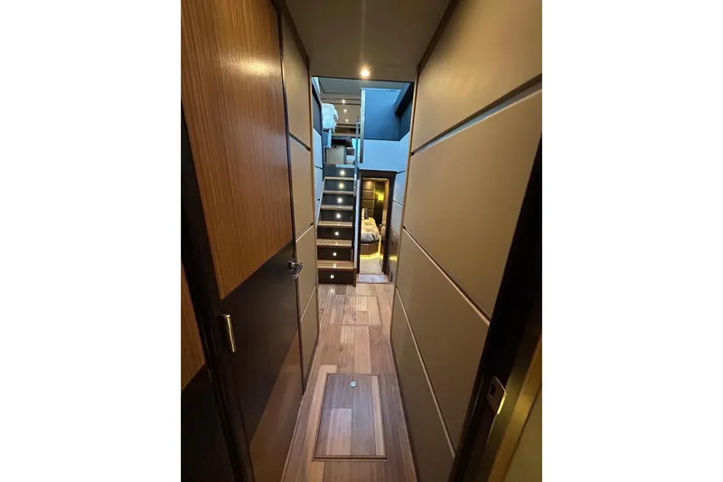 Special K Yacht Photos Pics Luxurious interior hallway of 2016 Sea Ray L650 yacht with modern wood paneling.