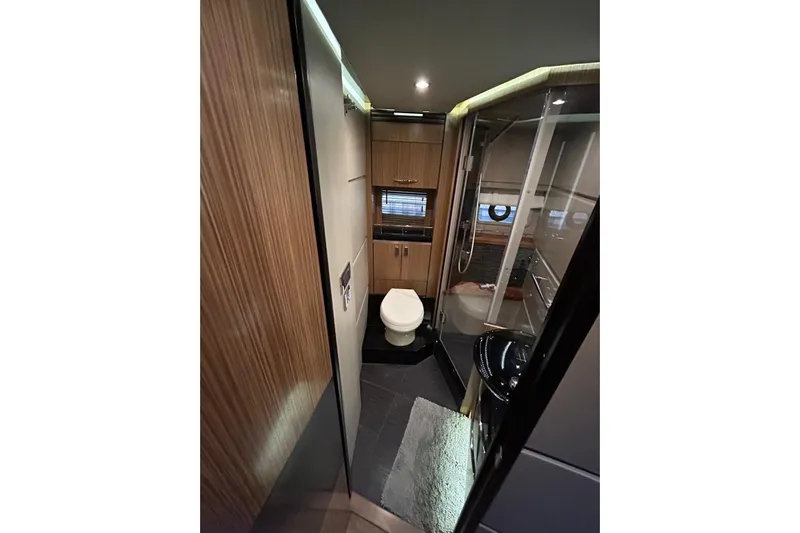 Special K Yacht Photos Pics Luxurious bathroom interior of 2016 Sea Ray L650 yacht with modern amenities.