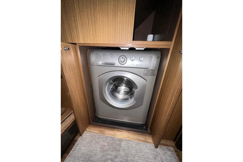 Special K Yacht Photos Pics Washing machine inside 2016 Sea Ray L650 yacht's wooden cabinet.