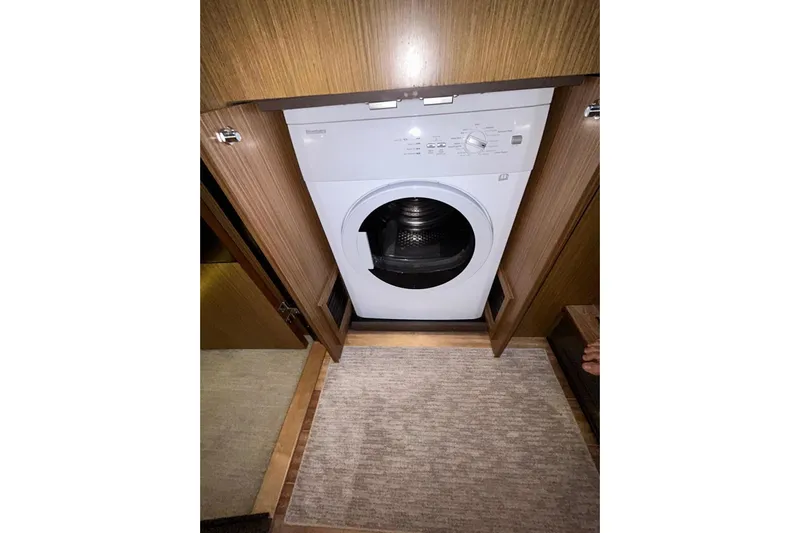 Special K Yacht Photos Pics Washing machine in 2016 Sea Ray L650 yacht's wooden interior compartment.