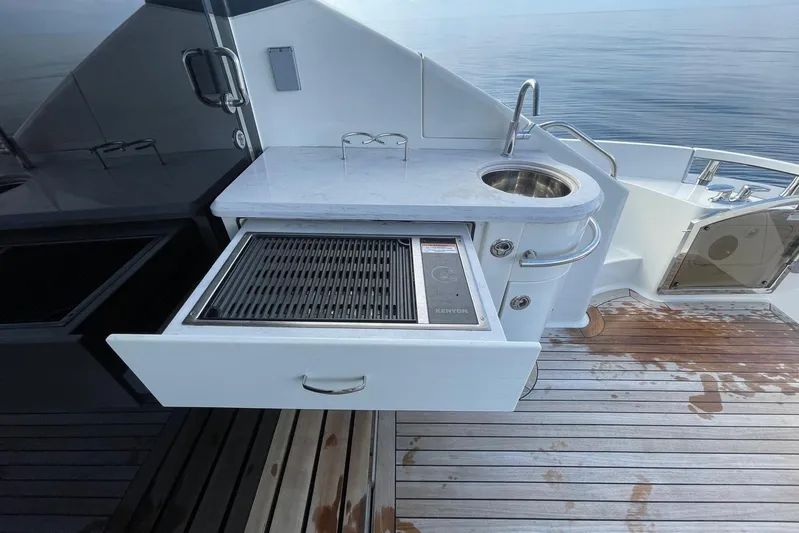 Special K Yacht Photos Pics Outdoor kitchen on 2016 Sea Ray L650 yacht with grill and sink.