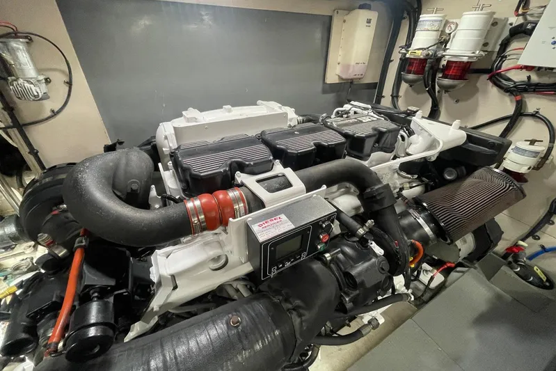 Special K Yacht Photos Pics Engine room of 2016 Sea Ray L650 yacht, showcasing a powerful marine engine.
