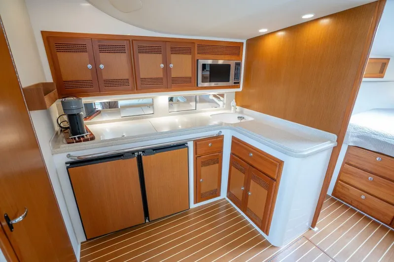 Kat's Meow Yacht Photos Pics Luxurious 2004 Cabo 40 Express yacht interior with modern kitchen amenities.