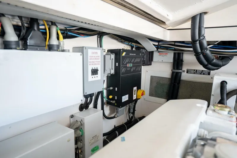 Kat's Meow Yacht Photos Pics Engine room of 2004 Cabo 40 Express boat, showcasing electrical systems and wiring.