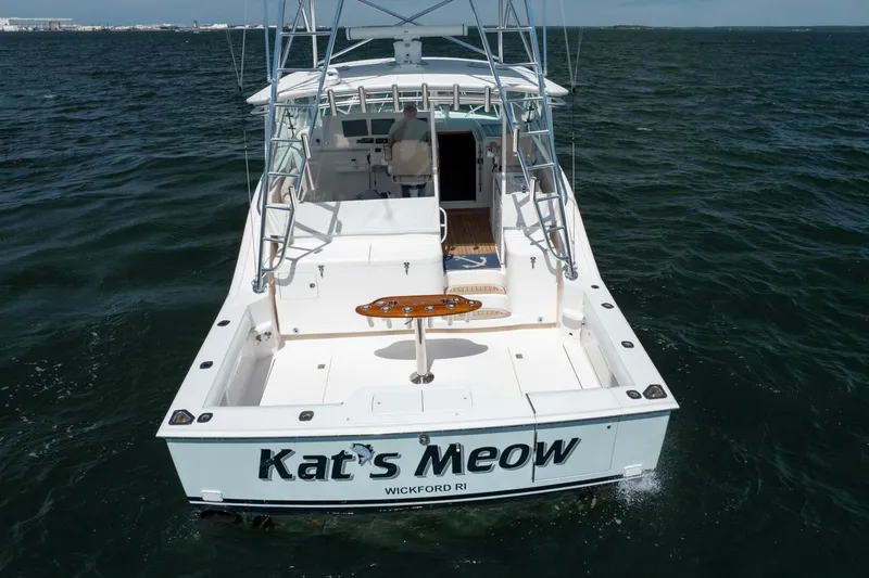 Kat's Meow Yacht Photos Pics 2004 Cabo 40 Express boat named "Kat's Meow" on open water, rear view.