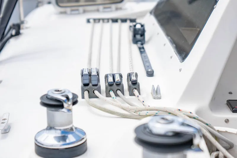 Making Waves Yacht Photos Pics Close-up of Seawind 1160 sailboat deck rigging, showcasing winches and cleats, 2006 model.