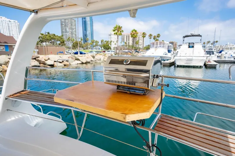 Making Waves Yacht Photos Pics Seawind 1160 catamaran with a grill on deck, docked at a marina, 2006 model.