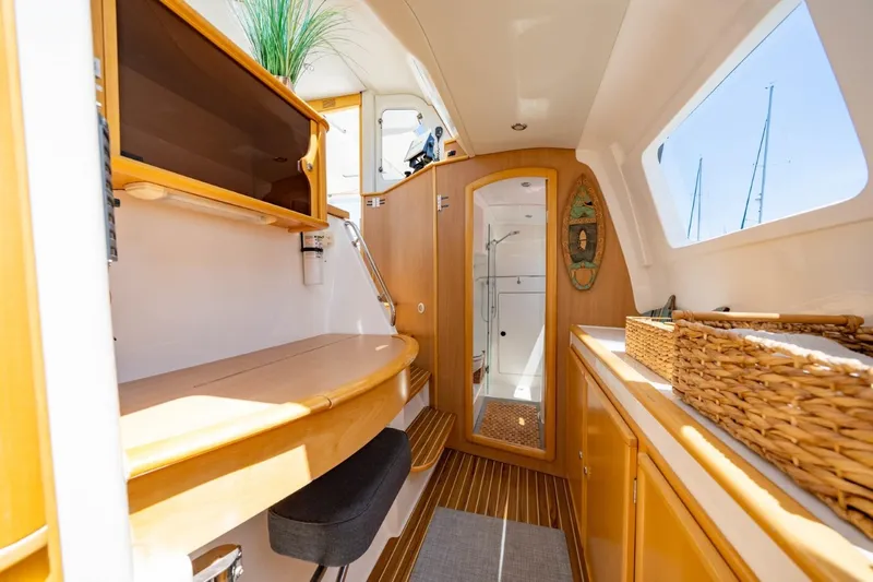 Making Waves Yacht Photos Pics Interior of 2006 Seawind 1160 catamaran with wooden cabinetry and modern design.