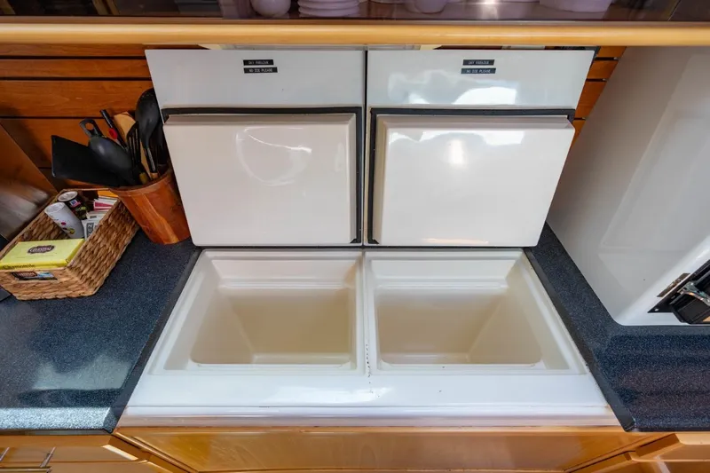 Making Waves Yacht Photos Pics Seawind 1160 2006 yacht kitchen with dual sinks and storage compartments.