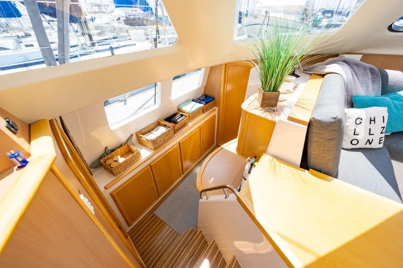 Making Waves Yacht Photos Pics Interior of 2006 Seawind 1160 catamaran with cozy seating and stylish decor.