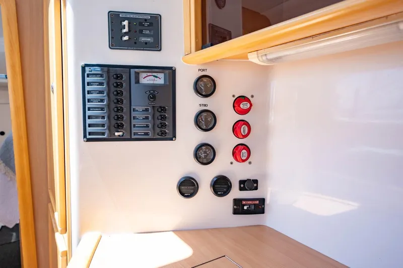 Making Waves Yacht Photos Pics Electrical control panel on a 2006 Seawind 1160 catamaran, featuring switches and gauges.