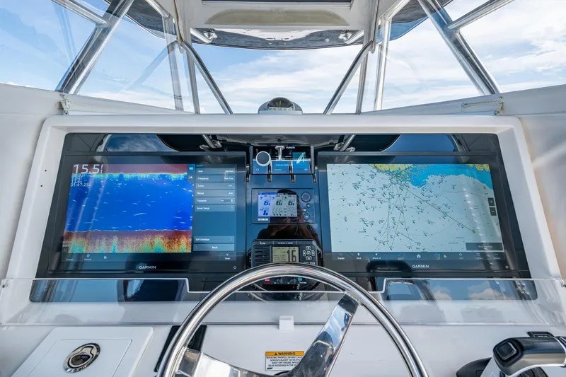  Yacht Photos Pics Control panel of 2015 Invincible 42 Open Fisherman with dual Garmin displays.