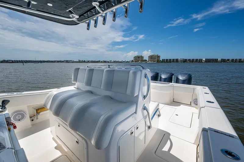  Yacht Photos Pics 2015 Invincible 42 Open Fisherman boat interior with seating, ocean view, and clear sky.