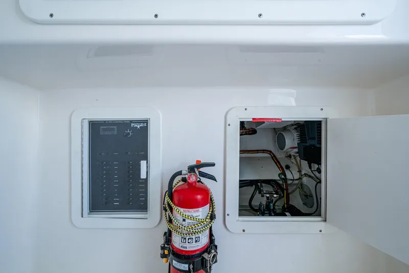  Yacht Photos Pics Electrical panel and fire extinguisher on 2015 Invincible 42 Open Fisherman boat.