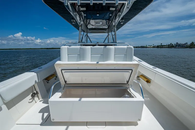  Yacht Photos Pics 2015 Invincible 42 Open Fisherman boat with open storage compartment on deck.