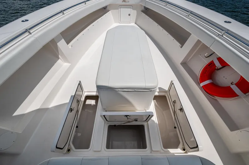  Yacht Photos Pics 2015 Invincible 42 Open Fisherman boat interior with storage compartments and life preserver.