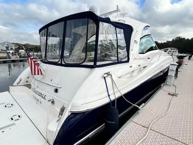  Yacht Photos Pics 2005 Sea Ray 500 Sundancer yacht docked, featuring sleek design and American flag.