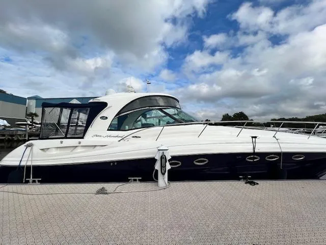  Yacht Photos Pics 2005 Sea Ray 500 Sundancer yacht docked under cloudy sky.