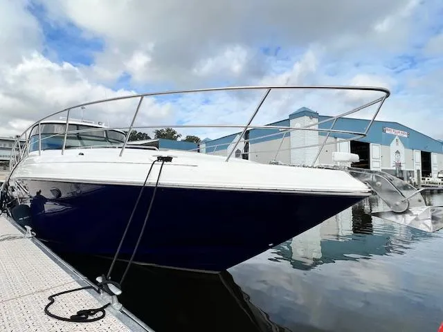  Yacht Photos Pics 2005 Sea Ray 500 Sundancer yacht docked at marina, reflecting on calm water.