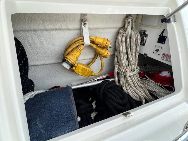  Yacht Photos Pics Storage compartment on a 2005 Sea Ray 500 Sundancer with ropes and cables.