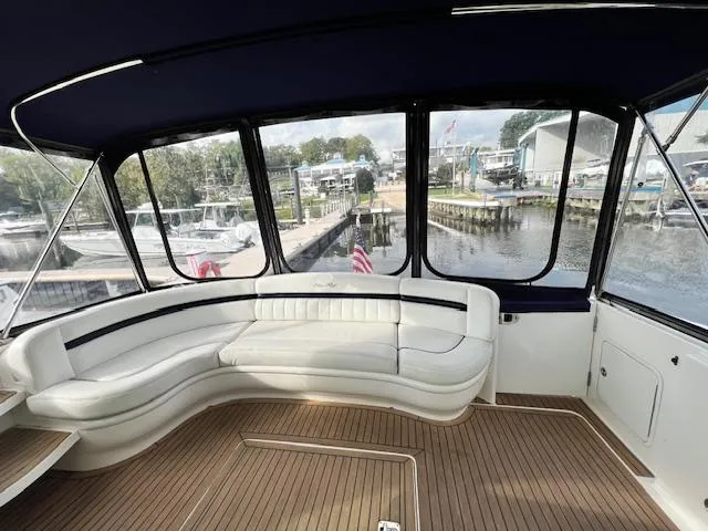  Yacht Photos Pics 2005 Sea Ray 500 Sundancer yacht interior with white seating and waterfront view.