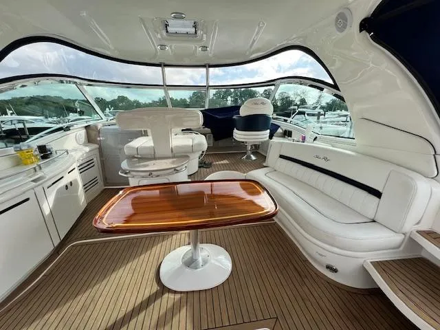  Yacht Photos Pics Luxurious 2005 Sea Ray 500 Sundancer yacht interior with elegant seating and wooden table.