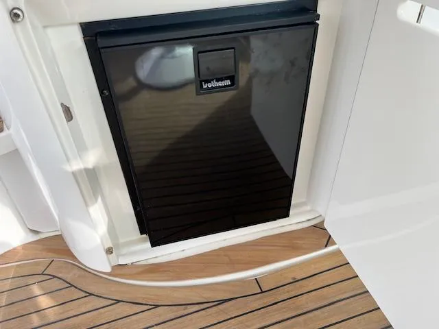  Yacht Photos Pics Built-in fridge on 2005 Sea Ray 500 Sundancer yacht with teak flooring.