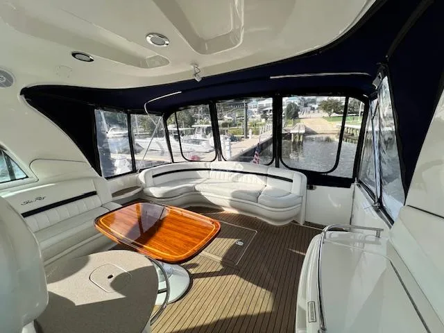  Yacht Photos Pics Luxurious 2005 Sea Ray 500 Sundancer yacht interior with elegant seating and wooden table.