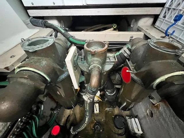  Yacht Photos Pics Engine room of 2005 Sea Ray 500 Sundancer, showcasing complex piping and mechanical components.