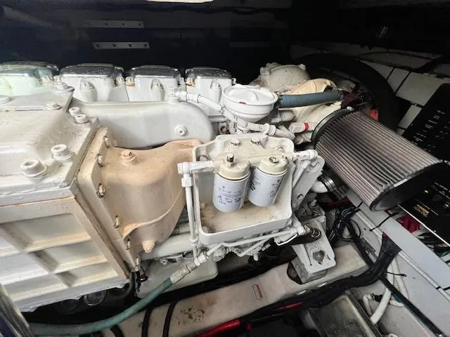  Yacht Photos Pics Engine compartment of a 2005 Sea Ray 500 Sundancer boat, showcasing mechanical components.