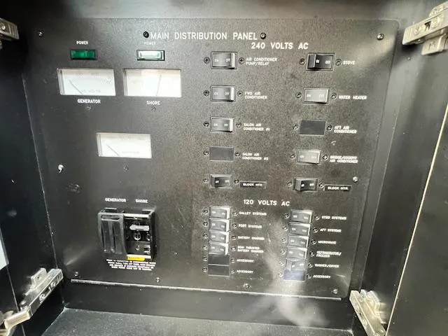 Yacht Photos Pics Main distribution panel of 2005 Sea Ray 500 Sundancer, showing 240V and 120V AC switches.