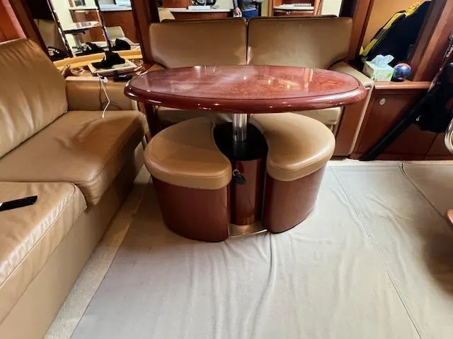  Yacht Photos Pics Luxurious interior of 2005 Sea Ray 500 Sundancer with elegant seating and table.