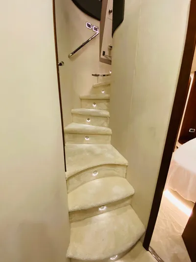  Yacht Photos Pics Interior staircase of 2006 Azimut 68 yacht with elegant lighting.