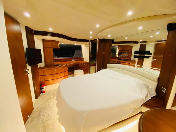  Yacht Photos Pics Luxurious bedroom interior of 2006 Azimut 68 yacht with modern furnishings.